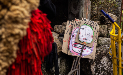 February 19, 2023, Montalegre, Misarela, Portugal: Posters that say No To Mines are seen during a small demonstration of Misarela Caretos against the lithium mines that are harming the entire ecosystem of Montalegre. Entrudo da Misarela is a socio-cultural dynamization project that aims to bring the two banks of Rabagao closer together, around the same idea: to recreate Entrudo as a celebration of the entrance of Spring. The event happens in the Misarela bridge, a bridge that was built in the middle ages, located in Montalegre in the North East of Portugal.